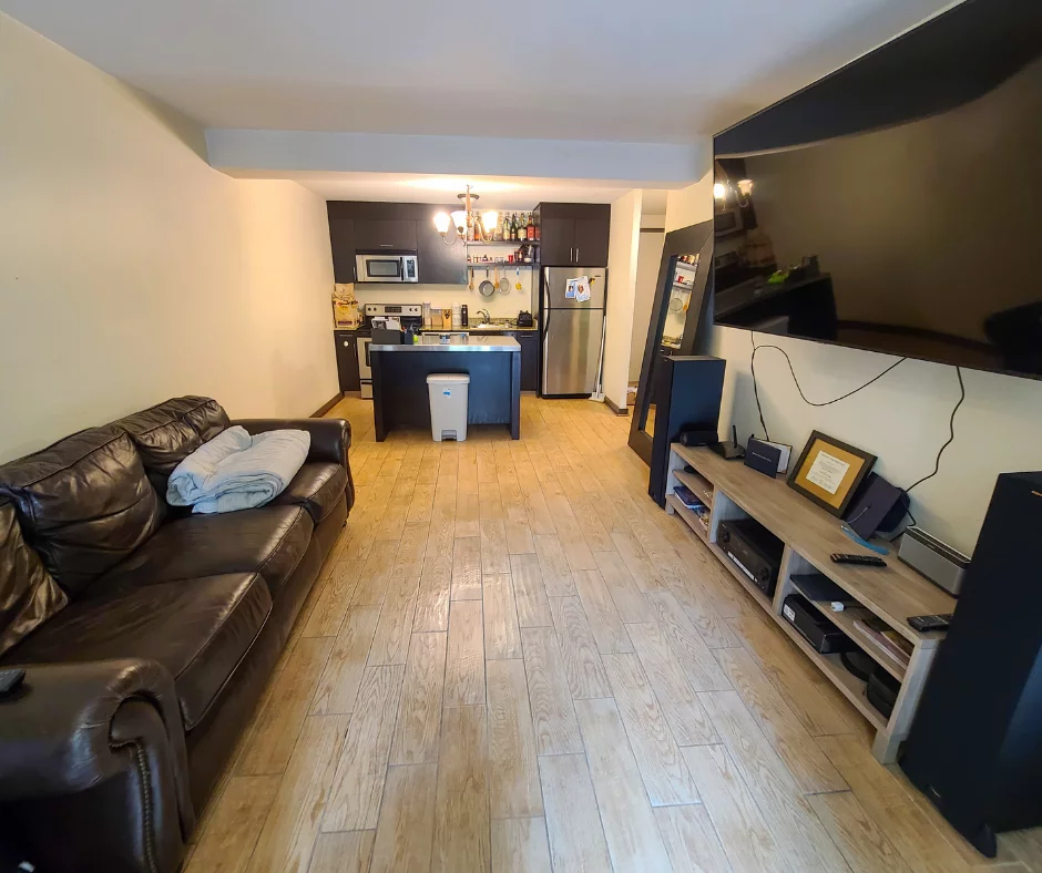 an organized living room and kitchen image